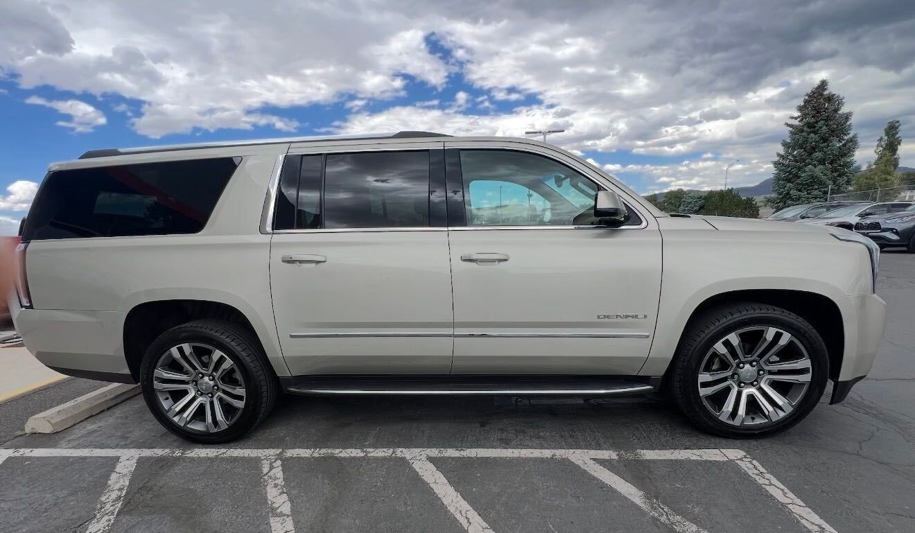 Tan GMC Yukon Denali exterior view